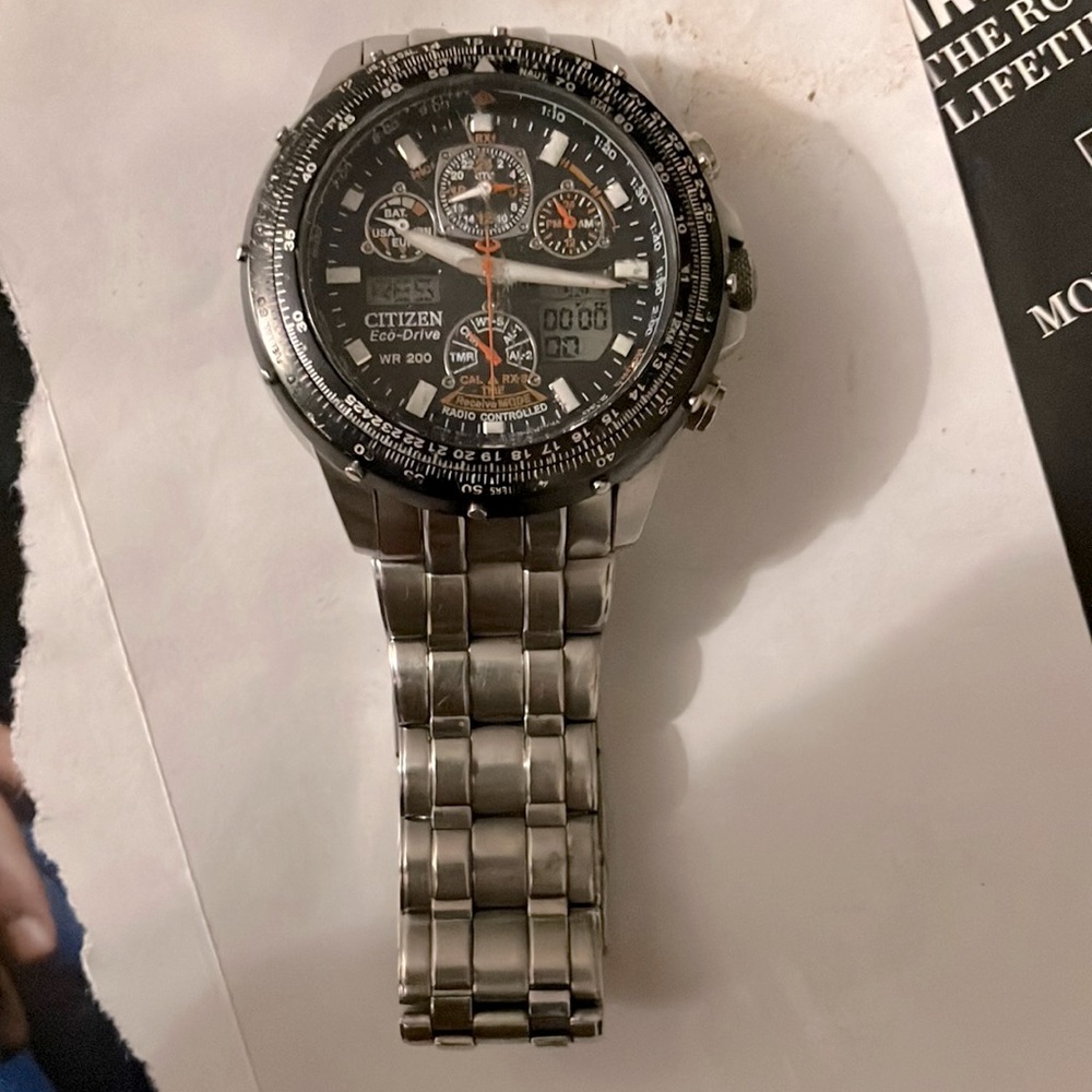 Citizenship eco drive silver black and orange face compass digital time as well